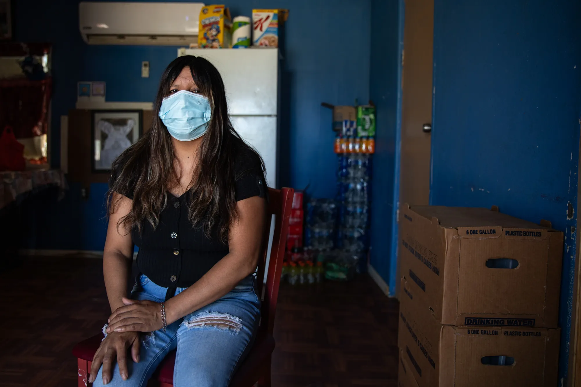 Entrika Zacarias sits in her home at Oasis Mobile Home Park in Coachella Valley.